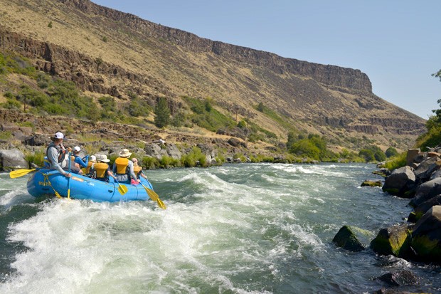 Nathan Wren guides a raft into Guide Launcher, a hole on the Deschutes River, Aug. 5 - RYLAN BOGGS