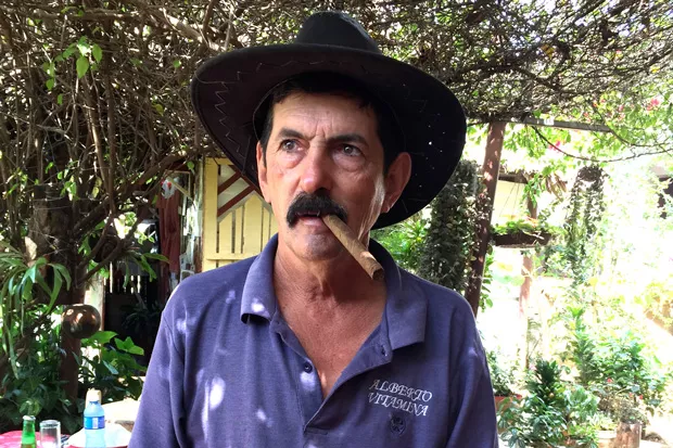 Alberto Vitamina shared more than just his roasted pig with his American visitor. - JOSHUA SAVAGE