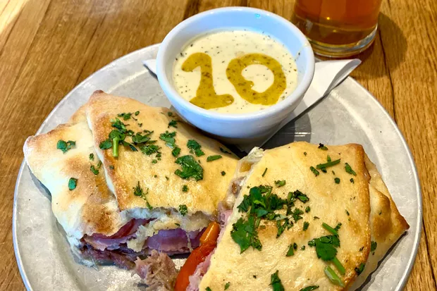 The Cubano Stromboli at 10 Barrel offers a unique take on the sandwich. - JOSHUA SAVAGE