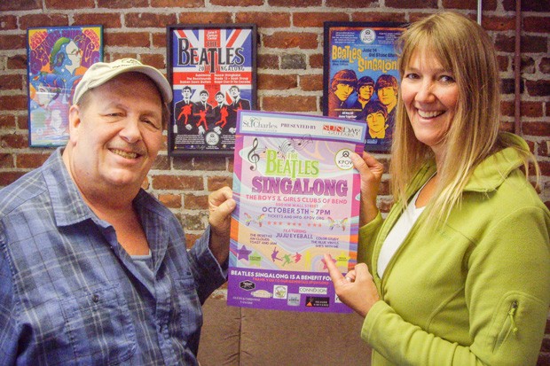 KPOV volunteers Rick Miller, left, and Lynn Bancroft hold up this year&#39;s Beatles Singalong poster in front of posters from past Singalongs. - RICHARD SITTS