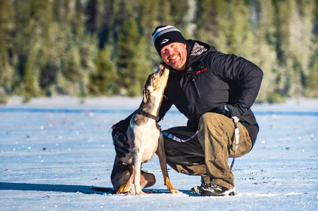 JD Platt and one of his dogs, Wallowa, during the photo shoot for Central Oregon Pets at Dutchman Flat. - DARRIS HURST