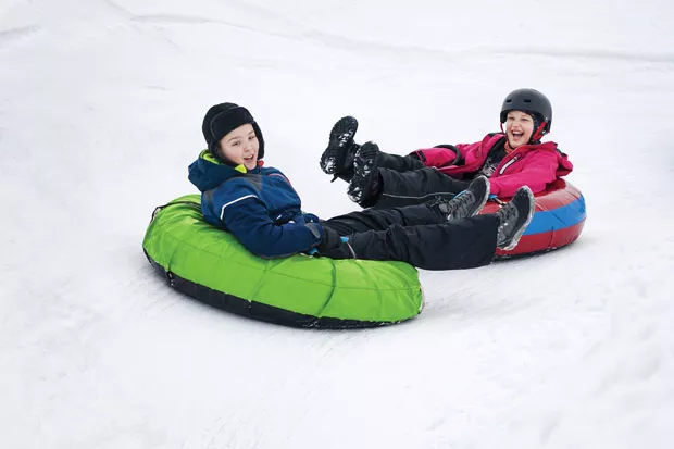 Family fun at the Snowblast Tubing Park. - ADOBE STOCK