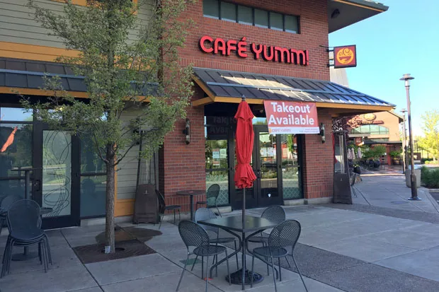 Café Yumm in the Old Mill District has closed down all indoor table service, but customers are welcome to sit outside on the patio. Owner Karli Foster has spaced the tables 10 feet apart for social distancing. - DARRIS HURST