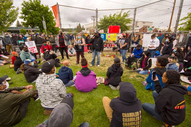 Waites speaks at the Black Lives Matter vigil Saturday at Troy Field in downtown Bend. - DARRIS HURST