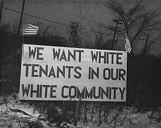 Sign with American flag "We want white tenants in our white community," directly opposite the Sojourner Truth homes, a U.S. federal housing project in Detroit, Michigan. A riot was caused by white neighbors' attempts to prevent African American tenants from moving in. - HISTORICAL PHOTO FROM WIKIPEDIA