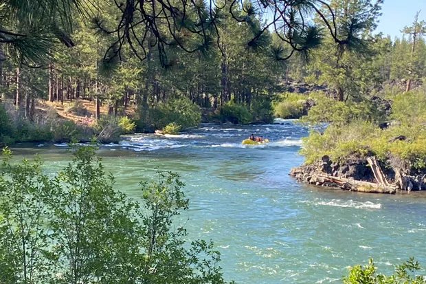 The Big Eddy rapid on the Deschutes River was busy with commercial raft boats on Sunday, July 5. Raft guides and customers wore masks. - LAUREL BRAUNS