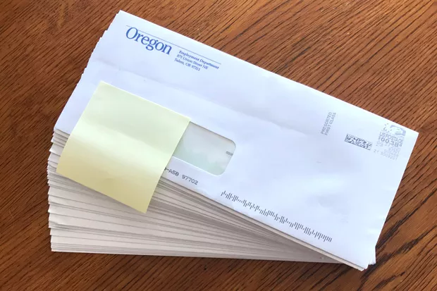 Twenty-seven checks arrived in Jason Brummond's mailbox at the same time last week, adding up to many thousands of dollars from the Oregon Employment Department. - JASON BRUMMOND