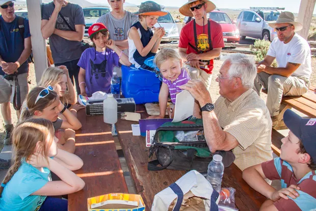 Jim Anderson teaching school children in the outdoors. - SUE ANDERSON