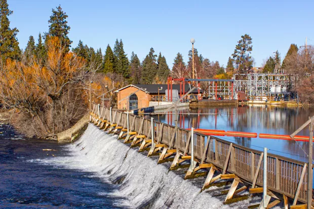The Newport Avenue dam was first built in 1909, creating Mirror Pond. At the time, it provided an abundant source of power for the small town of Bend. Today it provides enough power for less than 1,000 Bend homes. - DARRIS HURST