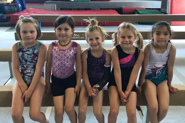All smiles inside the Central Oregon Gymnastics Academy. - COURTESY OF SHARMAN WATT