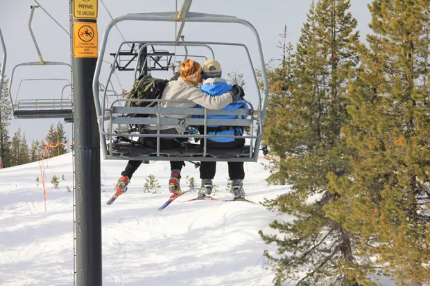 Riding the chair with friends is one way to feel the love—but riding alone also offers opportunities for a "meet cute." - K.M. COLLINS