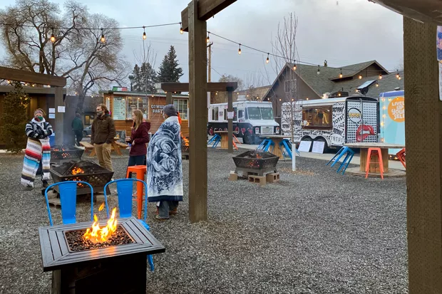 Warm clothing and firepits are a comfy combination at the Midtown Yacht Club. - NICOLE VULCAN