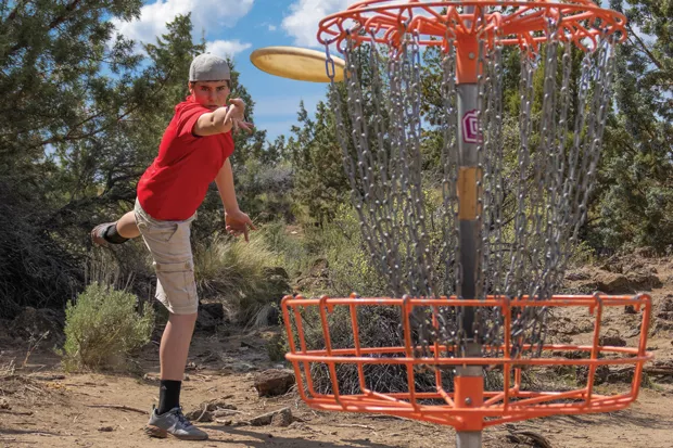 Xander Hurst focuses on the putt at Pine Nursery Park. - DARRIS HURST
