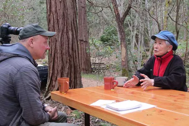Hideko Tamura-Snider chats with Jim Gersbach of the Oregon Department of Forestry about the Peace Tree project in Oregon. - COURTESY OREGON DEPARTMENT OF FORESTRY