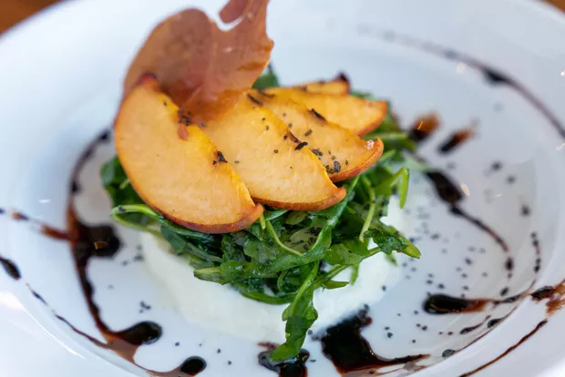 Grilled Peach Burrata, a summer favorite on the Solomon's at Tetherow menu. - MIKE WEST