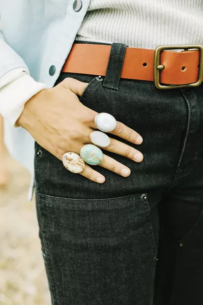 Bronwen Gemstone Rings by WorldScout, $98 / Outside In Heritage Leather Belt in Oro Russet $89 - DREW CECCHINI