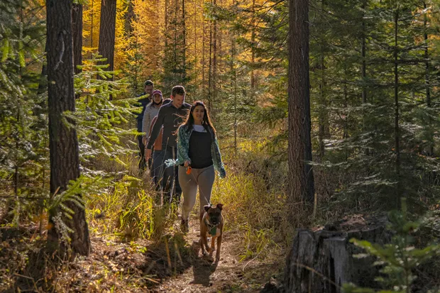 Hikers enjoy a fall hike with golden larch in the background. - JAY MATHER/DESCHUTES LAND TRUST