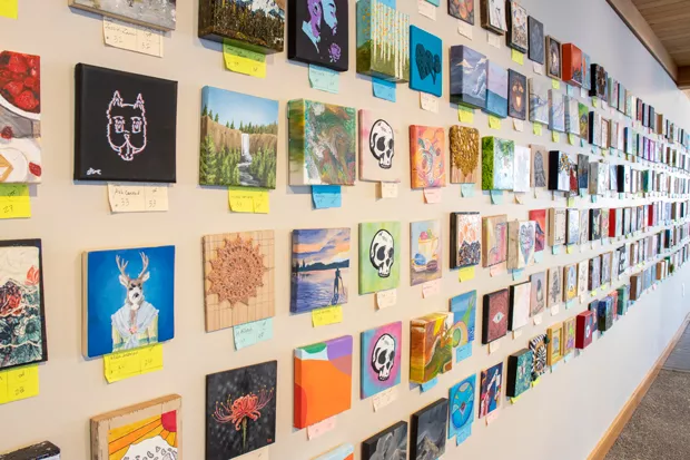 Hanging some 2,100 pieces of art was no small feat for Stuart Breidenstein and his team of art lovers. - DARRIS HURST