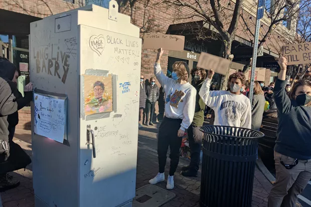 Protesters gather at the corner of Wall Street and Oregon Avenue where Ian Cranston shot Barry Washington Jr. in September. - JACK HARVEL