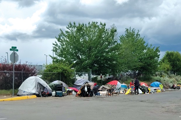 Camps line both sides of Emerson Avenue in Bend last summer. On June 2, the Bend City Council adopted policies that set criteria for the camp's removal. - JACK HARVEL