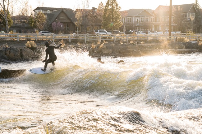 Wet thrills and spills await adventurers at the Whitewater Park. In this photo, Taylor Woods rips it up on the river wave. - CREDIT ERIC FRECKMAN