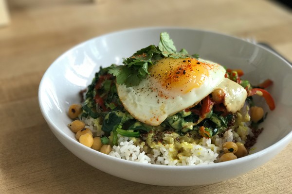 The Sunny Bowl is the most popular dish — it’s a combination - of veggies, garbanzo beans, cilantro and quinoa served over jasmine rice with a coconut curry sauce. - LISA SIPE