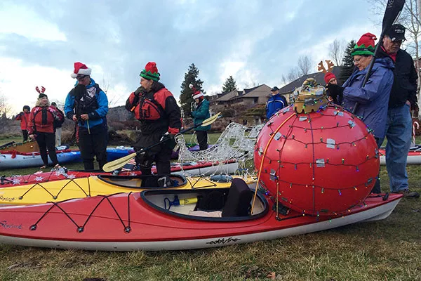 Gaggles of holiday celebrants gather with battery powered lights and parade vessels to charge the 2017 Holiday Lights Winter Paddle Parade. - COURTESY TUMALO CREEK KAYAK & CANOE