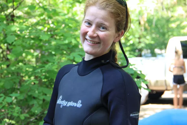 Young gun Bri of the Tumalo Creek rentals crew smiles and suits up, looking forward to a day tackling the inland whitecaps of the McKenzie River. - K.M. COLLINS