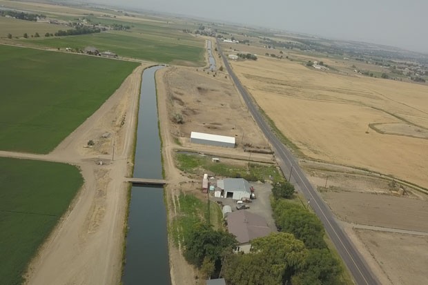 The North Unit Irrigation Canal parallels a farm in Madras. - TIM WEHDE, CENTRAL OREGON DAILY
