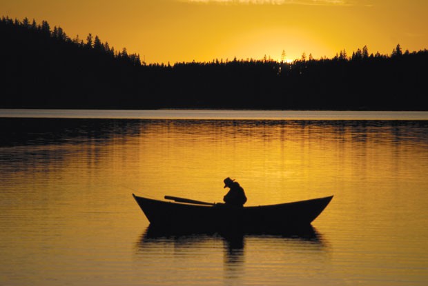 A lone fisherman at dusk on Paulina Lake. - FLICKR.COM/DIRTSAILOR2003