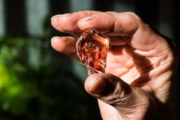 The author gets a closeup look at sunstone embedded in a piece of lava. - SUBMITTED