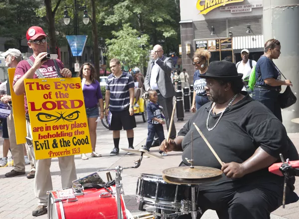 A jazz band played at the intersection of Tryon and Trade streets as protesters made their way toward the convention.