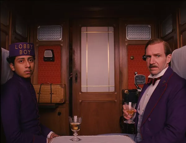 A WILD RIDE: Tony Revolori and Ralph Fiennes in The Grand Budapest Hotel. (Photo: Fox Searchlight)