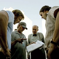 ARMS AND THE MEN Steven Spielberg holds a discussion with actors Daniel Craig, Hanns Zischler and Eric Bana on the set of Munich.