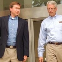 Attorney Russel Fergusson, left, and Todd Ford, co-owner of NoDa Brewery, leaving the City Council meeting Monday night.