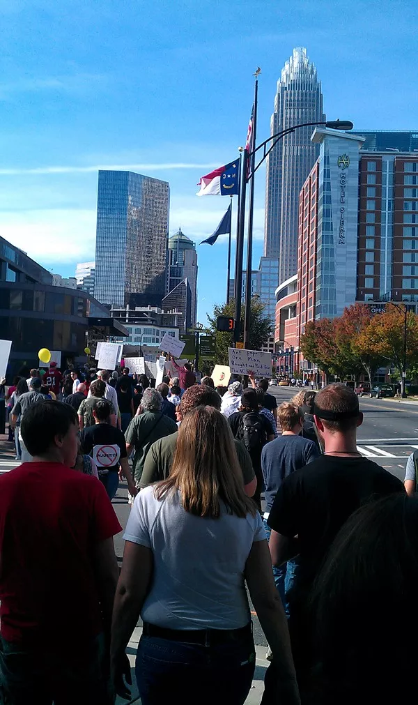 Bank of Americas headquarters tower in the distance as the Oct. 8 march begins