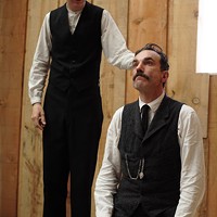 CHOOSING MY RELIGION: Daniel Plainview (Daniel Day-Lewis) briefly subjugates himself to preacher Eli Sunday's (Paul Dano) will in There Will Be Blood.