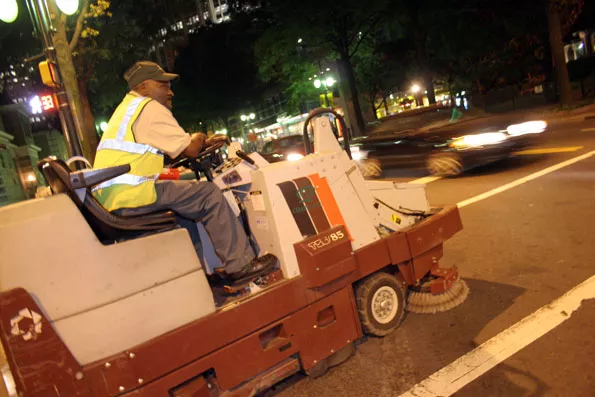 CLEANUP MAN: City employee Cald Welledward rides his sidewalk scrubber - CATALINA KULCZAR