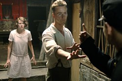 CULTURE CLASH Kitty (Naomi Watts) and Walter (Edward Norton) experience a run-in with a Chinese official in The Painted Veil. - WARNER INDEPENDENT