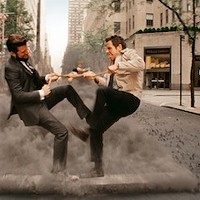 DAYDREAM BELIEVER: Walter (Ben Stiller, right) imagines that he and his boss (Adam Scott) are fighting over a Stretch Armstrong doll in The Secret Life of Walter Mitty. (Photo: Fox)