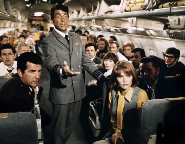 Dean Martin (standing) and Jacqueline Bisset in Airport (Photo: Universal)