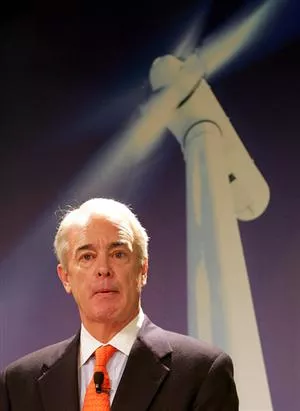 Duke Energy CEO Jim Rogers, beneath one of the wind turbines he says wont work in N.C.