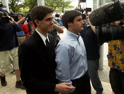 Duke lacrosse player David Evans escorted into the Durham County Detention Center after being indicted on sexual assault charges on May 15, 2006 - GETTY IMAGES