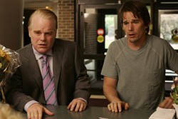 THINKFILM - FAMILY CRISIS: A hospital visit proves painful for siblings Andy (Philip Seymour Hoffman) and Hank (Ethan Hawke) in Before the Devil Knows You're Dead.