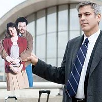 FAMILY PORTRAIT: Ryan Bingham (George Clooney) holds up a cardboard photo of his sister (Melanie Lynskey) and her fianc&eacute; (Danny McBride) in Up in the Air.