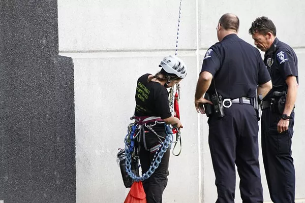 Five members of Rainforest Action Network were arrested this morning after they dangled a banner off Bank of America stadium that read Bank of Coal.