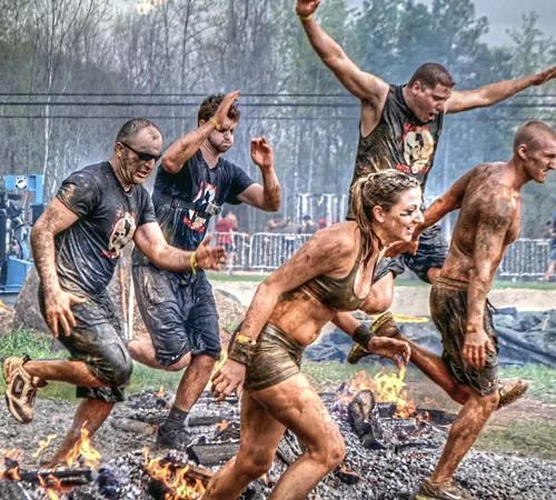 From left, Marco Ozdemir, Nick Mason, Nate Sallach and Jessica Nelso participate in a Spartan race. (Photo by Sam Brake)