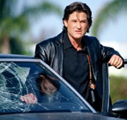 UNITED ARTISTS - GOOD COP,  BAD COP Maverick detective Kurt - Russell practices law and disorder in Dark Blue