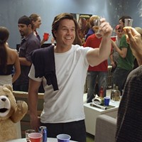 HE'LL OUTDRINK EVERY ONE OF US: Flash Gordon star Sam Jones (far right) does rum shots with Ted and John (Mark Wahlberg) in Ted. (Photo: Universal Pictures / Tippett Studio)