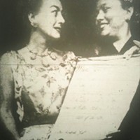 Joan Crawford, left,receiving an award from a member of Charlotte society in the late 1950s.